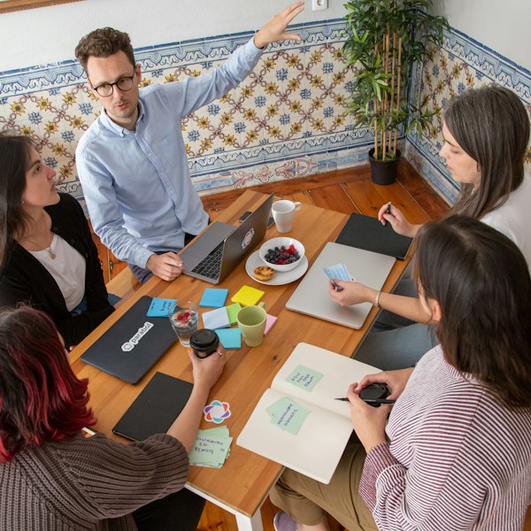 Group working with notes round a table